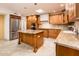 Modern kitchen with granite countertops and stainless steel appliances at 7837 E Crestwood Way, Scottsdale, AZ 85250