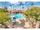 Community pool area with surrounding landscaping and seating at 7837 E Crestwood Way, Scottsdale, AZ 85250