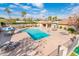 Community pool with lounge chairs and umbrellas at 7837 E Crestwood Way, Scottsdale, AZ 85250