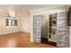 Bedroom with built-in shelving and patterned closet doors at 8019 N 14Th St, Phoenix, AZ 85020