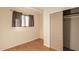 Small bedroom with hardwood floors and a closet at 8019 N 14Th St, Phoenix, AZ 85020