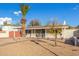 Mid-century home with a landscaped front yard and palm tree at 8019 N 14Th St, Phoenix, AZ 85020