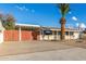 House exterior with gated entry and palm tree at 8019 N 14Th St, Phoenix, AZ 85020