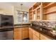 Modern kitchen with stainless steel appliances and wood cabinets at 8019 N 14Th St, Phoenix, AZ 85020