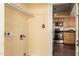 Laundry room with kitchen access and overhead shelving at 8019 N 14Th St, Phoenix, AZ 85020