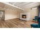 Living room with a fireplace and light wood floors at 8019 N 14Th St, Phoenix, AZ 85020