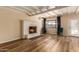 Bright living room featuring a fireplace and hardwood floors at 8019 N 14Th St, Phoenix, AZ 85020