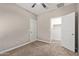 Bright bedroom with ceiling fan and closet at 8297 W Rushmore Way, Florence, AZ 85132