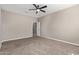 Bright bedroom featuring carpeted floors and a ceiling fan at 8297 W Rushmore Way, Florence, AZ 85132