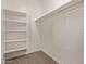 White built-in shelving and hanging rod closet at 8297 W Rushmore Way, Florence, AZ 85132