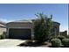 Charming single-story home features a two-car garage and well-maintained landscaping at 8297 W Rushmore Way, Florence, AZ 85132