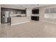 Spacious kitchen featuring an island, stainless steel appliances, and dark wood cabinets at 8297 W Rushmore Way, Florence, AZ 85132