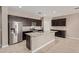 Bright kitchen with stainless steel appliances and an island at 8297 W Rushmore Way, Florence, AZ 85132