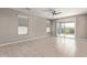 Spacious living room with tile floors and sliding glass doors at 8297 W Rushmore Way, Florence, AZ 85132