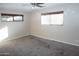 Well-lit bedroom featuring neutral walls and carpeted floors at 8643 S 16Th Pl, Phoenix, AZ 85042