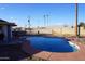 Kidney-shaped swimming pool in a large backyard at 8643 S 16Th Pl, Phoenix, AZ 85042