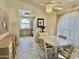 Cozy dining area featuring a ceiling fan and a view into the kitchen at 9131 W Boca Raton Rd, Peoria, AZ 85381