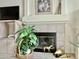 Cozy fireplace with decorative elements at 9131 W Boca Raton Rd, Peoria, AZ 85381