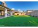 Backyard view showcasing artificial turf and a basketball court at 9625 E Spiral Ave, Mesa, AZ 85212