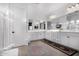 Bright bathroom featuring double sinks and white cabinets at 9625 E Spiral Ave, Mesa, AZ 85212