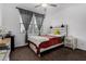 Cozy bedroom with a rustic bed frame and window seating at 9625 E Spiral Ave, Mesa, AZ 85212