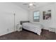 Charming bedroom with a gray bedspread and window at 9625 E Spiral Ave, Mesa, AZ 85212