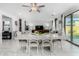 Bright dining room features a large table with seating for six and access to the kitchen at 9625 E Spiral Ave, Mesa, AZ 85212