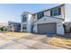 Two-story home with a light-colored exterior, a two-car garage, and a front yard at 9625 E Spiral Ave, Mesa, AZ 85212