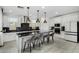 Modern kitchen boasts a large island with seating and stainless steel appliances at 9625 E Spiral Ave, Mesa, AZ 85212