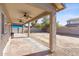 Covered patio with ceiling fans and large yard at 11625 W Jackson St, Avondale, AZ 85323