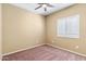 Simple bedroom with ceiling fan and shutters at 11625 W Jackson St, Avondale, AZ 85323