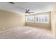 Bright bedroom with ceiling fan and window shutters at 11625 W Jackson St, Avondale, AZ 85323