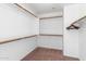 Large walk-in closet with double hanging rods at 11625 W Jackson St, Avondale, AZ 85323