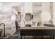 Bathroom with double sinks, modern lighting, and neutral tile at 13801 N Moon Dr, Phoenix, AZ 85023