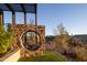 Landscaped yard with unique stone features and desert plants at 13801 N Moon Dr, Phoenix, AZ 85023