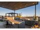 Modern outdoor kitchen with grill and bar area, offering scenic views at 13801 N Moon Dr, Phoenix, AZ 85023