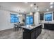 Kitchen with island and dining area, looking toward backyard at 14355 W Desert Hollow Dr, Surprise, AZ 85387