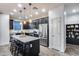 Modern kitchen with stainless steel appliances and island at 14355 W Desert Hollow Dr, Surprise, AZ 85387