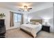 Main bedroom with a king-size bed and nightstands at 14355 W Desert Hollow Dr, Surprise, AZ 85387