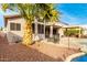 Home's backyard features a pool, patio, and lush landscaping at 1451 E Ivanhoe St, Gilbert, AZ 85295