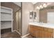 Bathroom features a shower, single sink vanity, and closet at 1451 E Ivanhoe St, Gilbert, AZ 85295