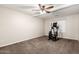 Large bedroom with carpeted floor and elliptical at 1451 E Ivanhoe St, Gilbert, AZ 85295