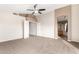 Spacious bedroom with ceiling fan and access to bathroom at 1451 E Ivanhoe St, Gilbert, AZ 85295