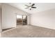 Spacious bedroom with carpet and sliding glass door to balcony at 1451 E Ivanhoe St, Gilbert, AZ 85295