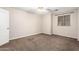 Well-lit bedroom featuring neutral carpeting at 1451 E Ivanhoe St, Gilbert, AZ 85295