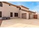 Home's exterior showcases a large garage and AC units at 1451 E Ivanhoe St, Gilbert, AZ 85295