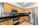 Kitchen boasts stainless steel appliances and dark countertops at 1451 E Ivanhoe St, Gilbert, AZ 85295