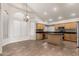 Kitchen features an island, stainless steel appliances, and light wood cabinets at 1451 E Ivanhoe St, Gilbert, AZ 85295