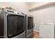 Laundry room with Maytag washer and dryer, plus freezer at 1451 E Ivanhoe St, Gilbert, AZ 85295