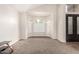 Living room with bay window and carpet flooring at 1451 E Ivanhoe St, Gilbert, AZ 85295